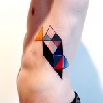 Colorful geometric tattoo on the left rib cage