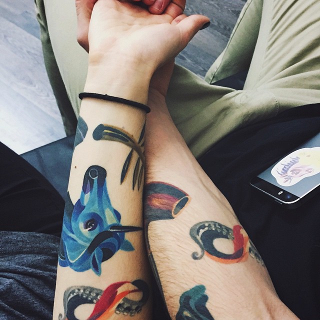 Colorful tattoos for a couple