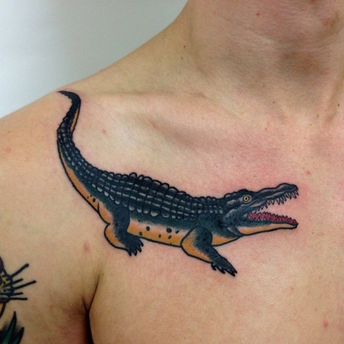 Cool aligator tattoo on the collarbone