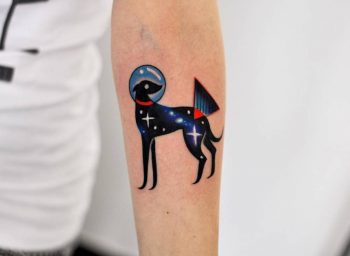 Cosmic dog tattoo on the arm