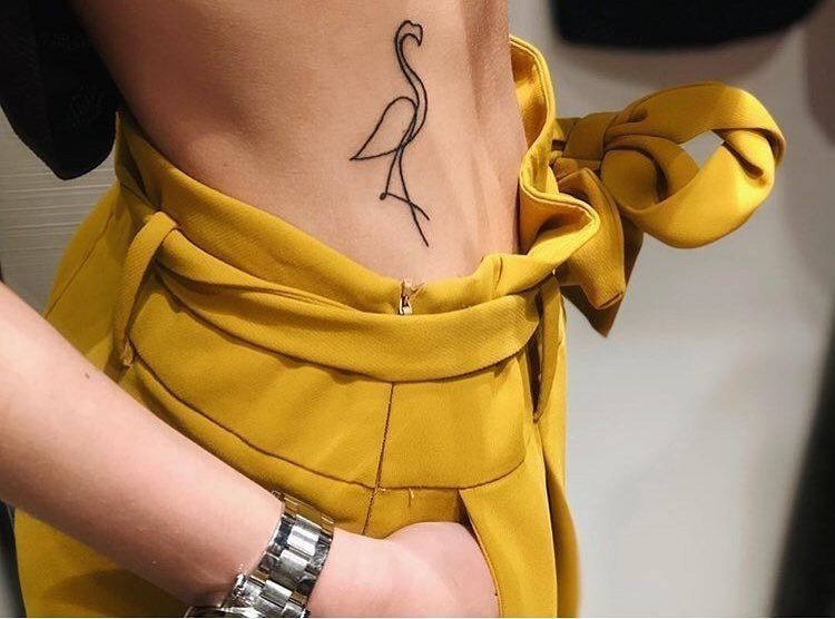 Crane tattoo on the side