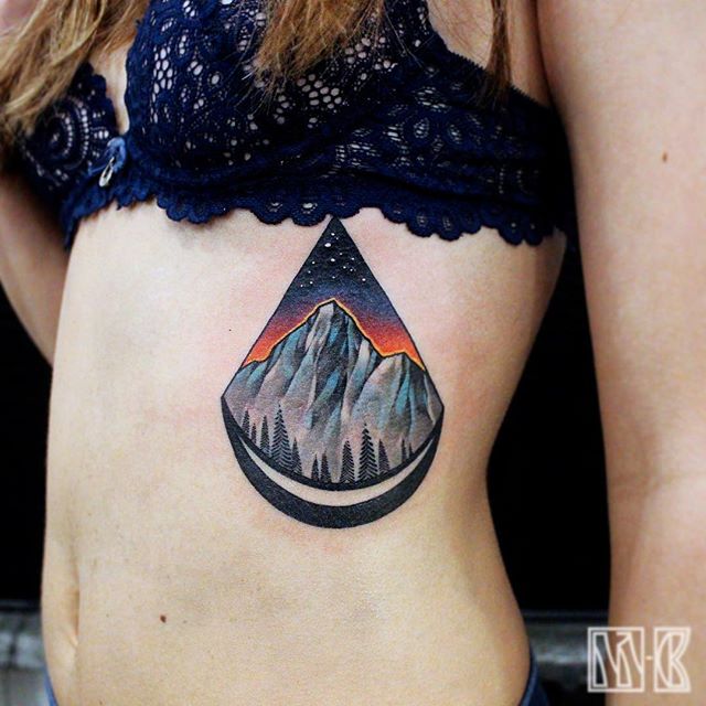 Crescent moon and mountain tattoo