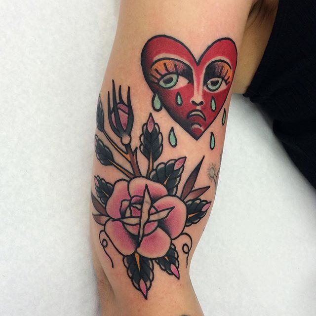 Crying heart and pink rose tattoo