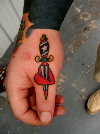 Dagger stabbed heart on the thumb
