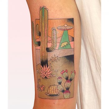 Desert landscape and alien abduction tattoo