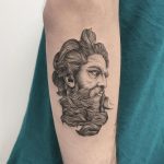 Detailed man's head tattoo
