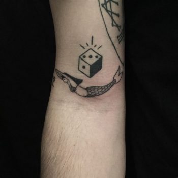 Dice and mermaid tattoo