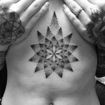 Dotwork ornamental tattoo on the sternum