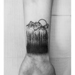 Dotwork trees mountains and sun tattoo