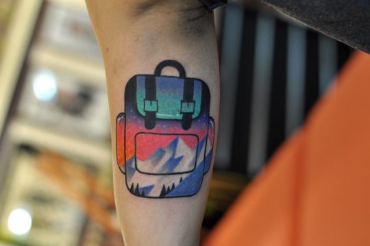 Double exposure backpack tattoo