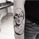 Eroding antique bust and skull tattoo