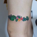 Exotic plants tattoo around the leg