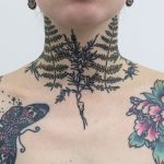 Fern leaves tattoo on the neck