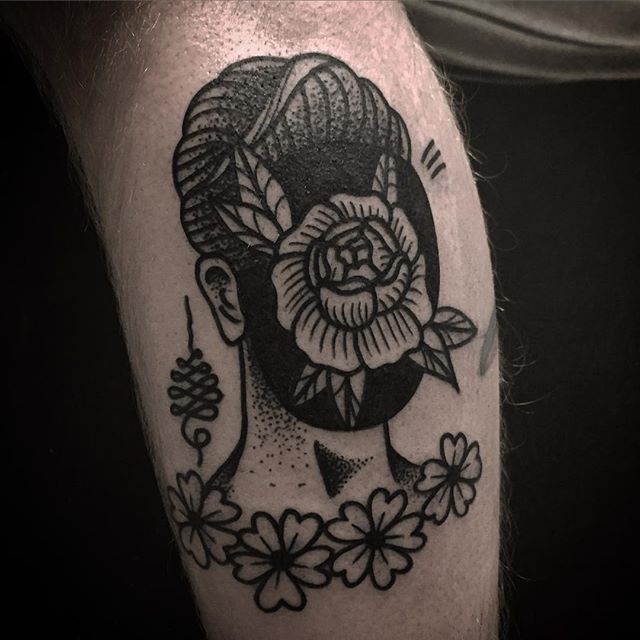 Floral face guy tattoo