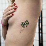 Four leaf clover tattoo on the rib