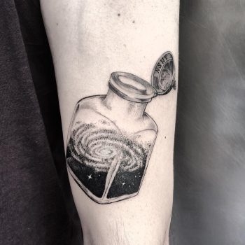 Galaxy in an ink bottle tattoo