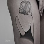Girl tattoo on the thigh