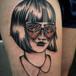 Girl with heart shaped glasses tattoo