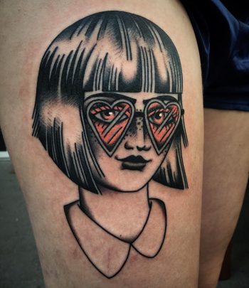 Girl with heart shaped glasses tattoo