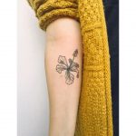 Gorgeous black and grey flower tattoo on the inner forearm