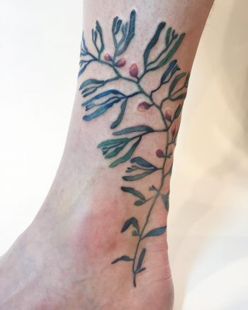 Green and red plant tattoo