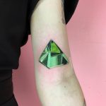 Green triangular diamond tattoo
