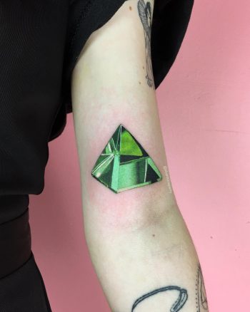 Green triangular diamond tattoo
