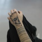 Half skull tattoo
