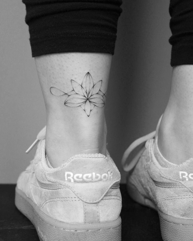 Handpoked lotus flower tattoo