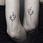 Handpoked matching tattoos for sisters