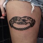Handshake and chain tattoo