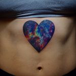 Heart shaped cosmic scenery tattoo
