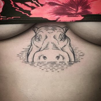 Hippopotamus tattoo on the sternum