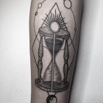 Hourglass and solar system tattoo