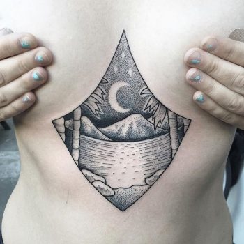 Landscape tattoo on the sternum