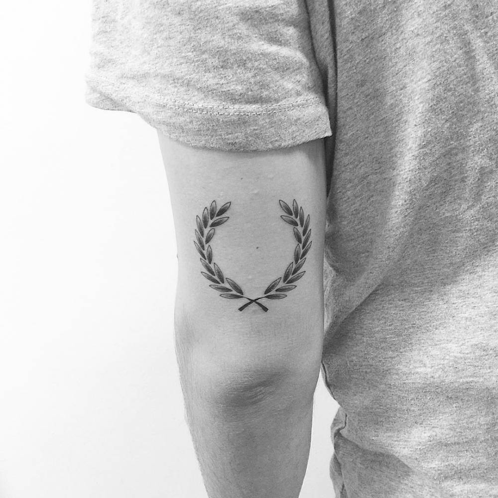 Laurel wreath tattoo on arm