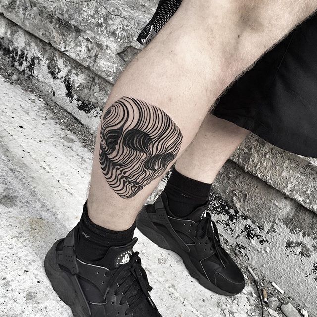 Linear black skull tattoo