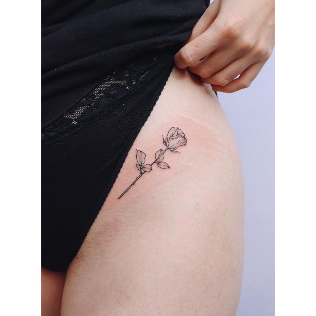 Little rose tattoo on the left hip