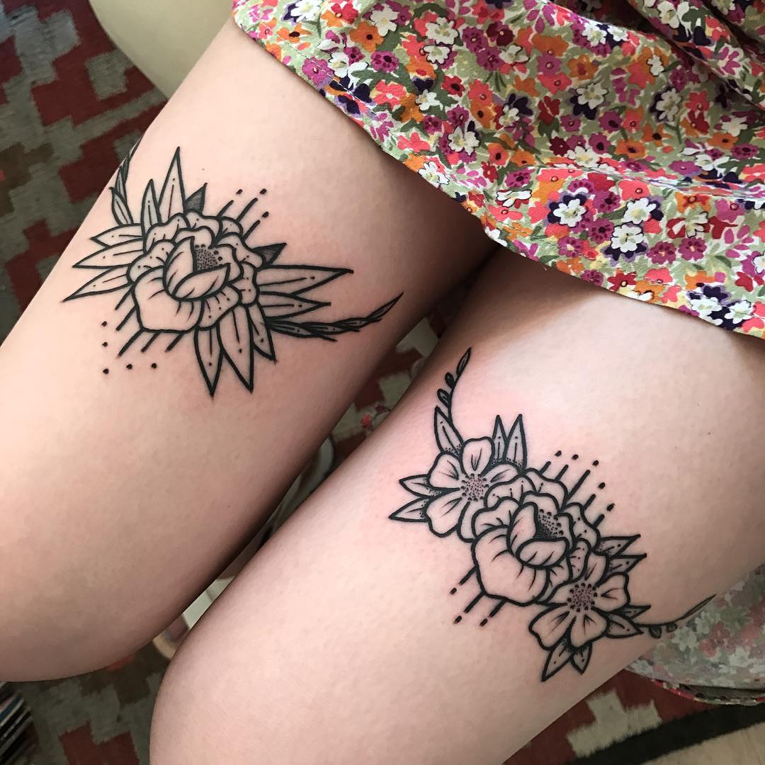 Lovely flower tattoos on thighs