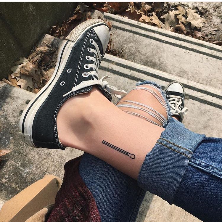 Match stick tattoo