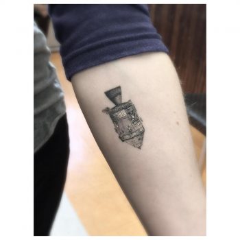Mini space capsule tattoo