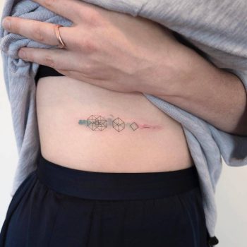 Minimalist geometric tattoo on the side