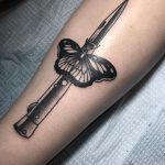 Moth and knife tattoo