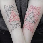 Negative space black and red tattoo