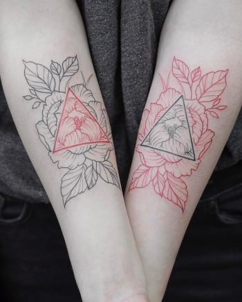 Negative space black and red tattoo