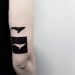 Negative space whale tattoo