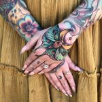 Neotraditional style tattoos on arms