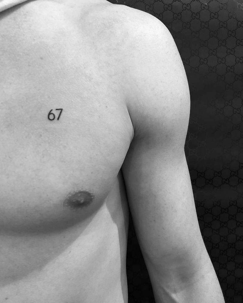 Number 67 tattoo