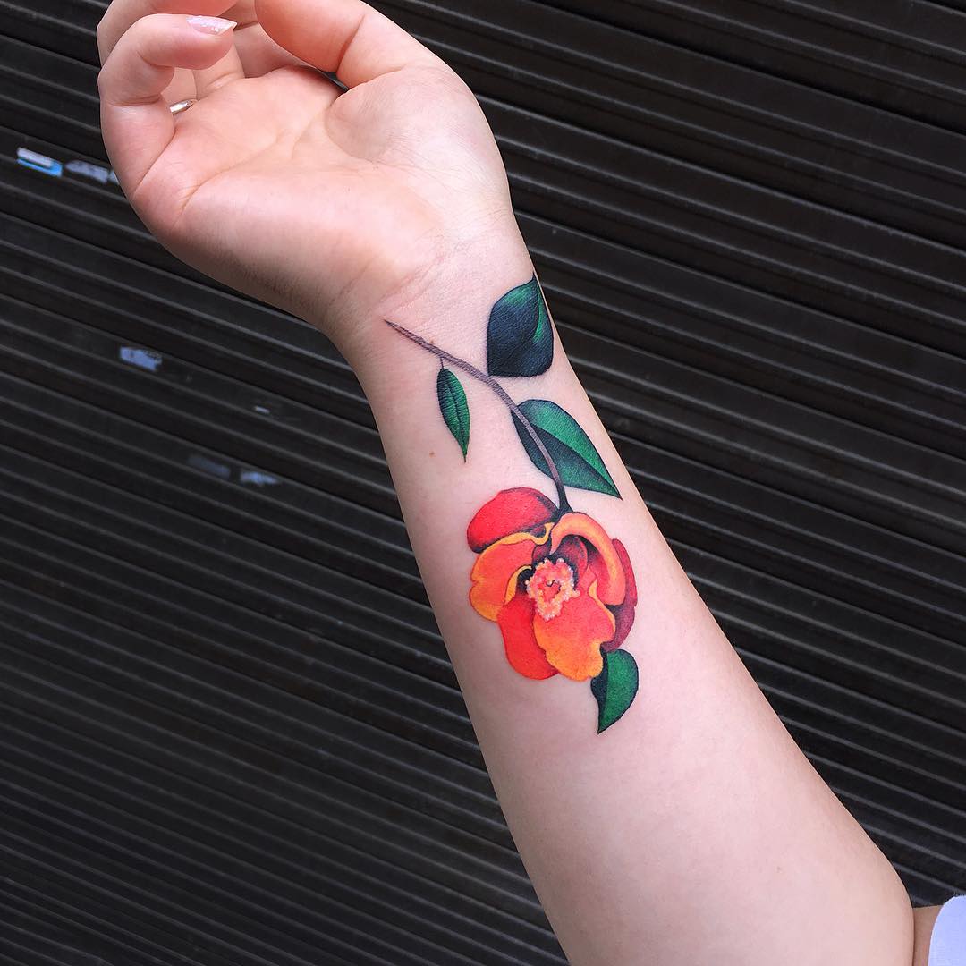 Orange and red flower tattoo