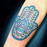 Ornamental colorful hamsa hand tattoo